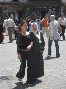 Young and old arm in arm in Damascus {DD}