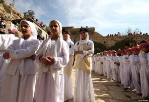 Yazidi children during a religious ceremony [Getty]