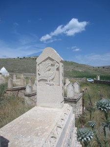 Yazidi tombstone in southeast Turkey showing the peacock symbol, representing God on earth [DD, May 2014]