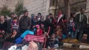 Madaya well-fed imposters with Syrian flag showing they are in Assad area