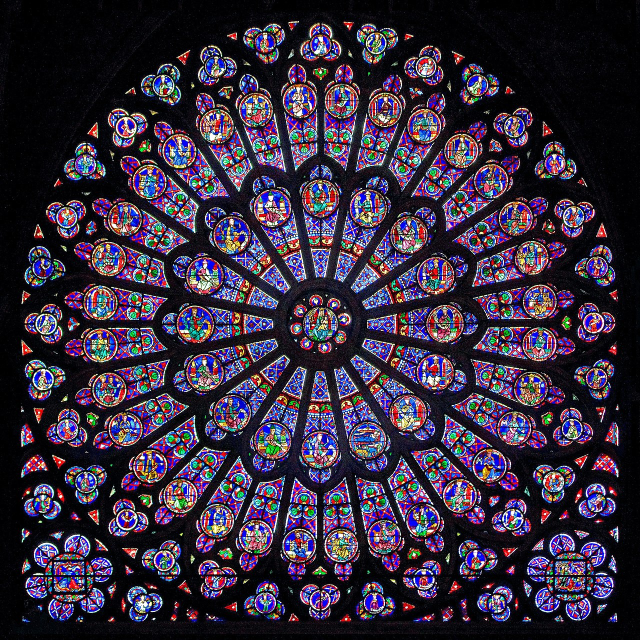 1280px-Gothic-Rayonnant_Rose-6 North rose window Notre Dame c1250